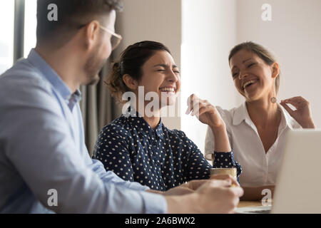 Happy laughing diverse business team of young professionals Stock Photo