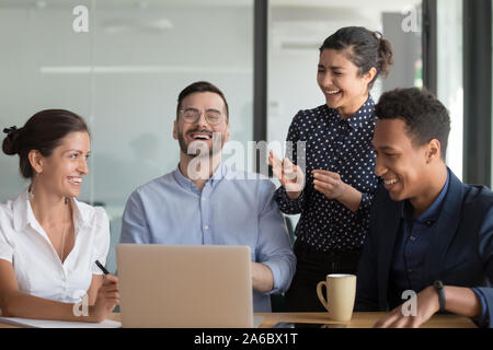 Happy multiethnic workers team having fun during business meeting Stock Photo