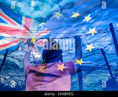 Brexit, human trafficking, immigration, asylum... concept image. Rear view of woman looking through barbed wire fence; UK and EU flags overlayed. Stock Photo