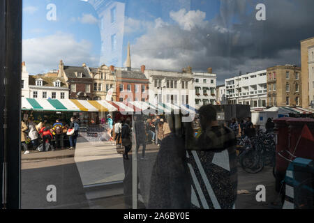 Market reflected in shop window Cambridge 2019 Stock Photo
