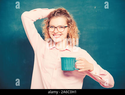 Great time. energy and vigor. energy charge. school teacher need coffee break. good morning. girl refreshing with tea drink. idea and inspiration. woman with coffee cup at blackboard. Stock Photo