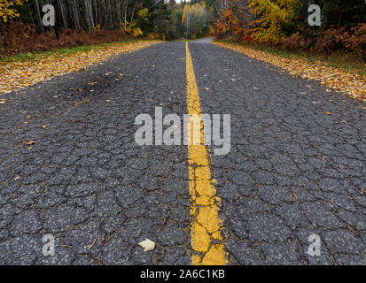 Quebec,Canada. A crumbling asphalt road in Rawdon. Stock Photo