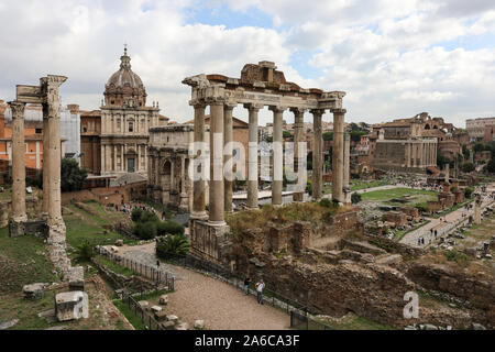 Temple of Saturn and other ancient Roman ruins in Forum Romanum, Rome, Italy Stock Photo