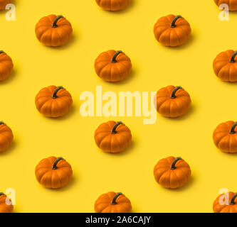 Autumn seamless pattern. Pumpkins on yellow background Stock Photo