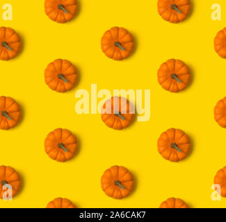 Autumn seamless pattern. Pumpkins on yellow background Stock Photo