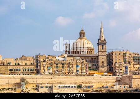 Coastal landscape of Valletta at sunny summer day, with its traditional architecture of yellow limestone. Maltese Valletta skyline Stock Photo