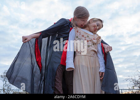 Two young girls are playing Count Dracula. Stock Photo