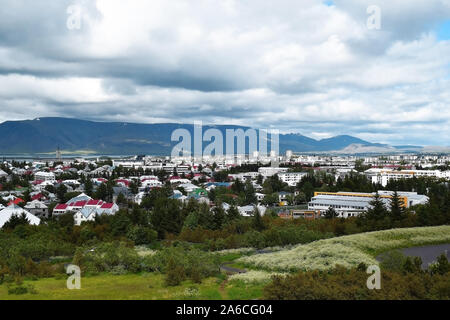 Reykjavik, Iceland panoramic view, with colorful rooftops, green trees and blue skies Stock Photo