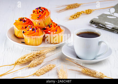 Expresso coffee with halloween muffins Stock Photo