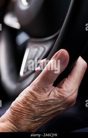 Senior woman driving a car. Stock Photo