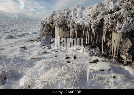 Icicles and hoar frost on Whernside carpeted in snow and ice mid winter Yorkshire Dales Stock Photo