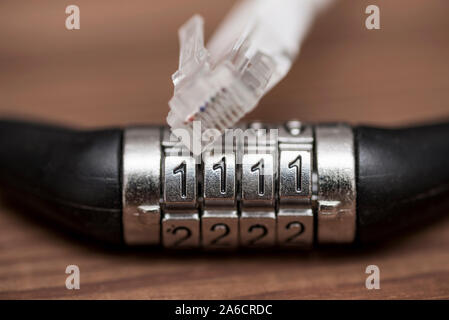 Computer internet cable and lock. Internet security concept. Digital cyber safety or security encryption concept. Stock Photo