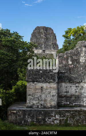 Central Acropolis complex in the UNESCO World Heritage archeological site of Tikal National Park in Guatemala.  The roof comb of Temple V is behind. Stock Photo