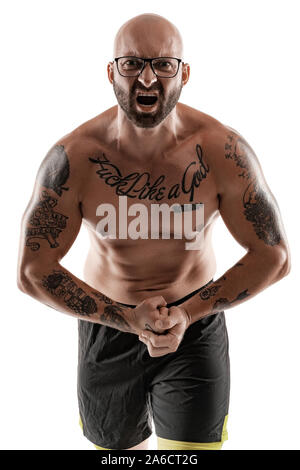 Handsome bald, bearded, tattooed man in glasses, black shorts is posing and showing his muscles isolated on white background, screaming and looking at Stock Photo - Alamy
