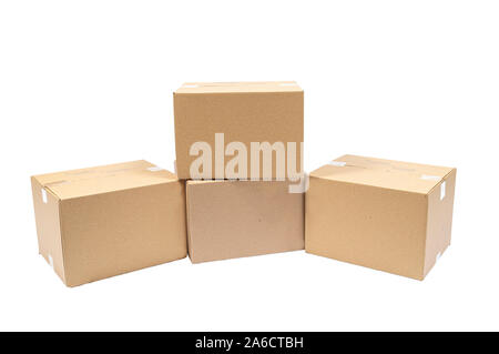 Horizontal shot of four blank stacked shipping boxes isolated on white. Stock Photo