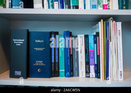 A bookshelf in a library of a legal firm with law books Stock Photo