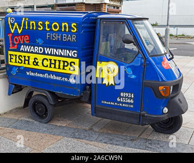 A three-wheeled van advertising Winston’s Fish Bar in Weston-super-Mare, UK Stock Photo