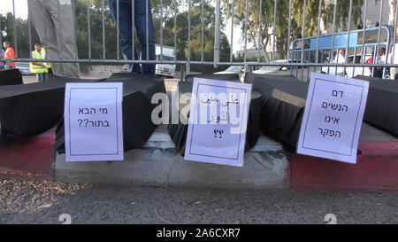 Signs against violence on black coffins in a protest against violence in Arab society and inactivity of police, in front of Northern District police headquarters in Nazareth, Israel, October 22, 2019 Stock Photo