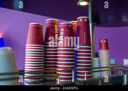 Stacked up Costa Coffee branded take away not recyclable cups Stock Photo