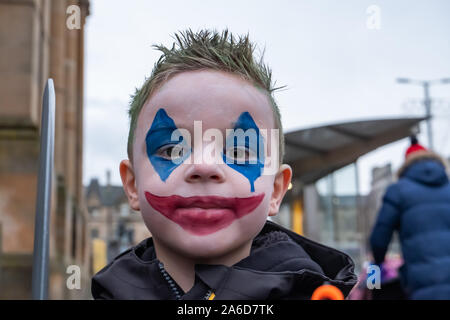 Paisley, Scotland, UK. 25th October, 2019. A boy dressed as The Joker at The Paisley Halloween Festival. Credit: Skully/Alamy Live News Stock Photo