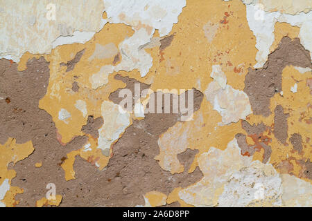 a peeling plaster on a wall Stock Photo