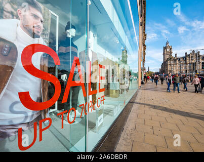 Sale sign shop window, offering 70 % off, Princes Street, Edinburgh, Scotland, UK Stock Photo