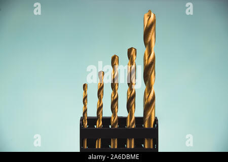 Yellow drills in black case on blue background isolated. Suitable for any purprose use. Stock Photo
