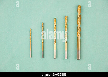 Yellow drills on blue paper background isolated. Suitable for any purprose use. Stock Photo