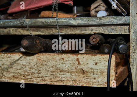 Old rusty tools on the garage rack claoseup Stock Photo
