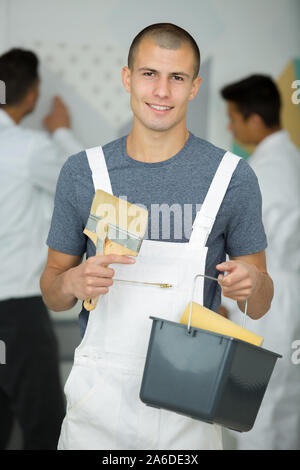 portrait of a young house painter and decorator apprentice Stock Photo
