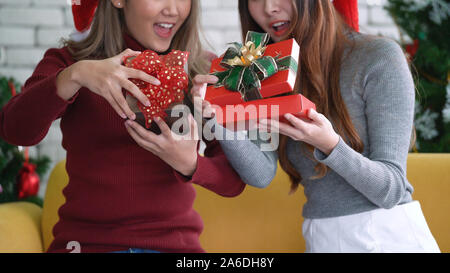 Asian girls open gift box with excited and happy face in Christmas morning Stock Photo
