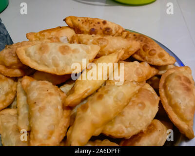 'Gujiya', a traditional dessert from the state of Uttar Pradesh, India, is made on the festivals of 'Holi' and 'Diwali' Stock Photo