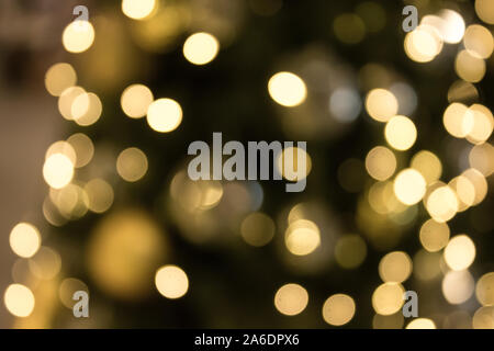 Christmas with gold bokeh light background. Xmas abstract blur and glowing decorations outdoors. Stock Photo