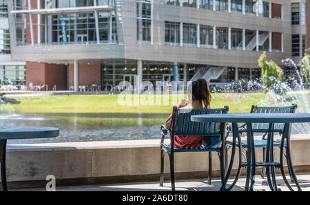 College student on the beautiful campus of the University of North Florida in Jacksonville, Florida. (USA) Stock Photo