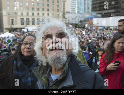 Vancouver, Canada. 25th Oct, 2019. Environmentalist David Suzuki looks up for the source of wind whipped splashes of rainwater after Swedish teen activist Greta Thunberg arrives for the post federal election Friday climate strike march starting and ending at the Vancouver Art Gallery in Vancouver, British Columbia on Friday, October 25, 2019. Credit: UPI/Alamy Live News Stock Photo