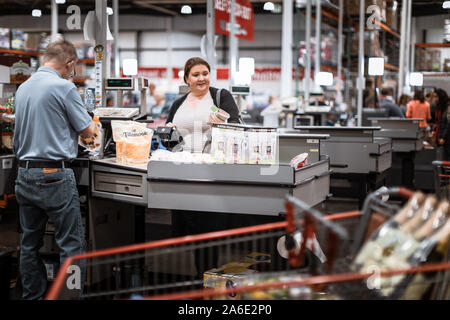 Tigard, Oregon - Oct 25, 2019 : Costco wholesale customer paying at checkout counter Stock Photo