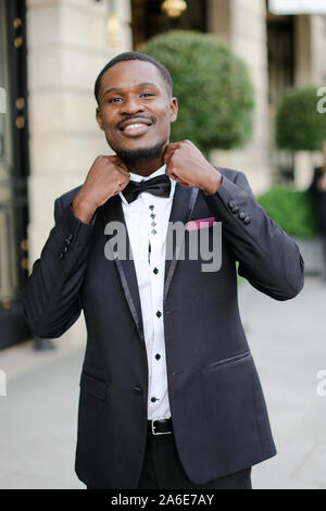 Afro american happy good looking man wearing suit and smiling. Stock Photo