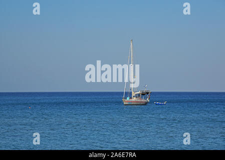 Sailing boat anchored at Kourmeneos bay, Crete, Greece. Stock Photo