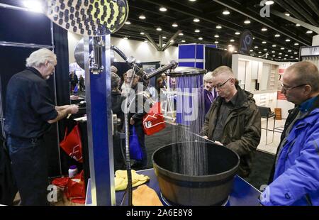 Vancouver, Canada. 25th Oct, 2019. Visitors view shower equipment during the Fall Home Show at Vancouver Convention Centre in Vancouver, Canada, Oct. 25, 2019. Over 350 exhibitors showcased their latest products and services during the three-day event. Credit: Liang Sen/Xinhua/Alamy Live News Stock Photo