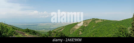 Panaromic view from Bodbe Monastery, Sighnaghi-St. Nino Monastery with green yard and mountain in Sighnaghi, Stock Photo