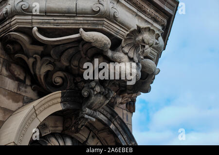 Ancient Dragon sculpture above building doorway on 18th century Welsh building Stock Photo
