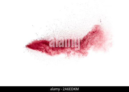 Red dust particles explosioon on white background.Red powder splatter. Stock Photo