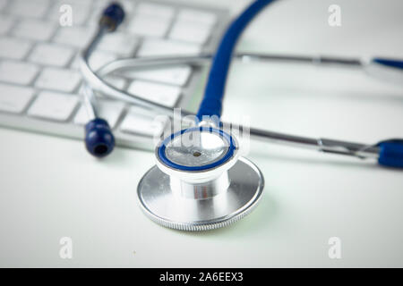 Stethoscope on laptop keyboard. Concept 3D image. Stock Photo