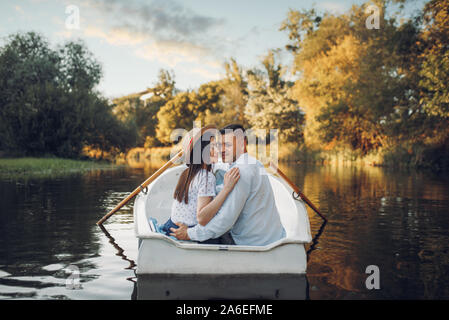 Happy love couple boating on lake, romantic date Stock Photo