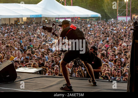 MADRID - SEP 7: A videographer recording at a concert at Dcode Music Festival on September 7, 2019 in Madrid, Spain. Stock Photo