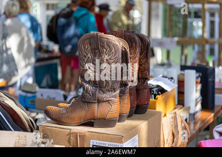 The Antiques market, La Flotte, Ile de Re, France.  Cowboy boots for sale Stock Photo