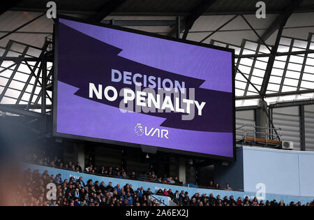 A VAR decision is displayed on the big screen as they check a penalty ...