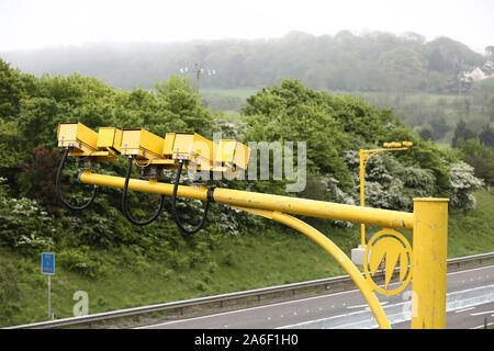 May 2014 - Bright yellow average speed camera monitoring the M5 motorway in Somerset. UK. Stock Photo