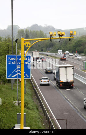 May 2014 - Bright yellow average speed camera monitoring the M5 motorway in Somerset. UK. Stock Photo