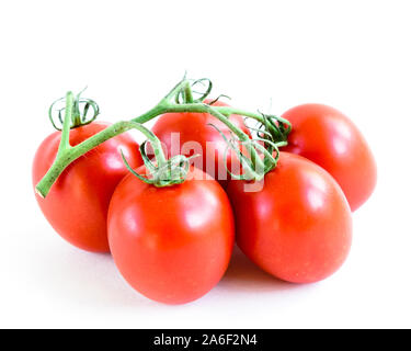 Studio shot organic five on vine ripened Roma tomatoes isolated on white background Stock Photo
